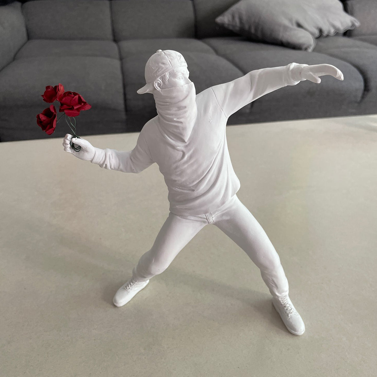 The Rioter Sculpture – street-art-inspired figure with flower bouquet – STUDIO GONKA