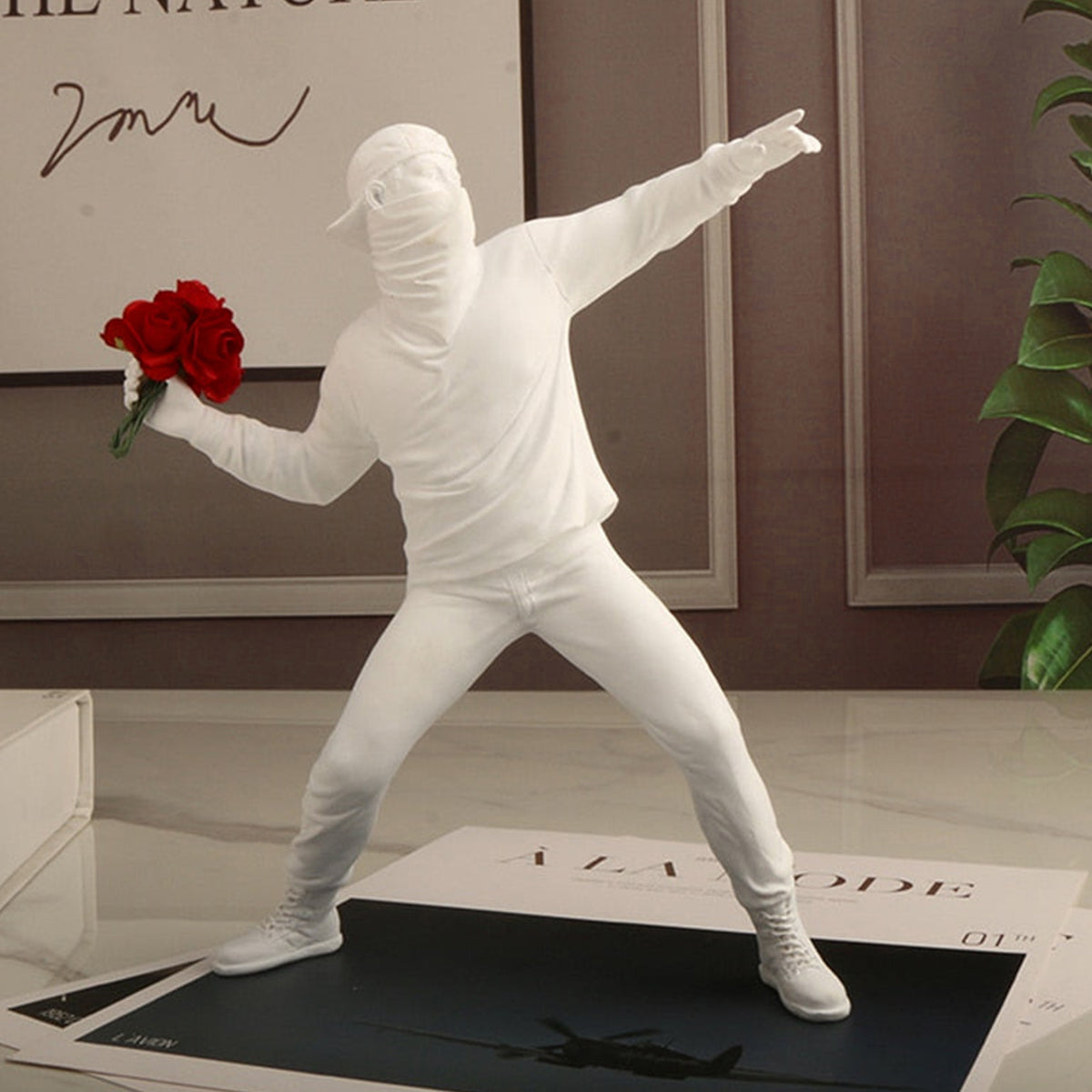 The Rioter Sculpture – street-art-inspired figure with flower bouquet – STUDIO GONKA