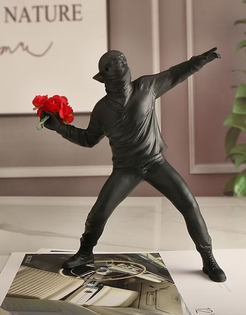 The Rioter Sculpture – street-art-inspired figure with flower bouquet – STUDIO GONKA